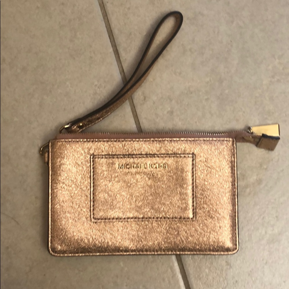 Micheal Kors rose gold wristlet